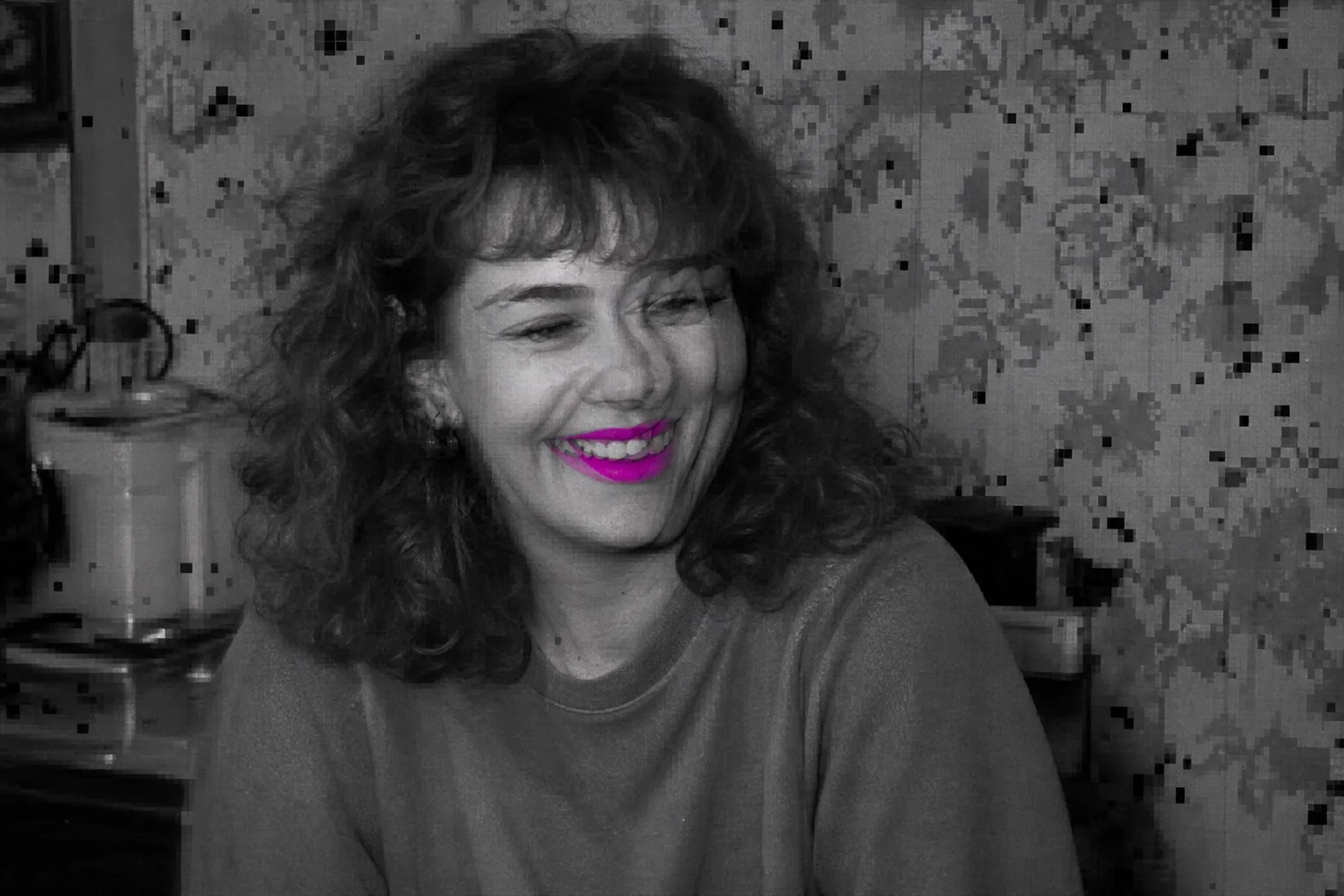 Glitched frozen frame from a home video tape with tracking errors and color bleed